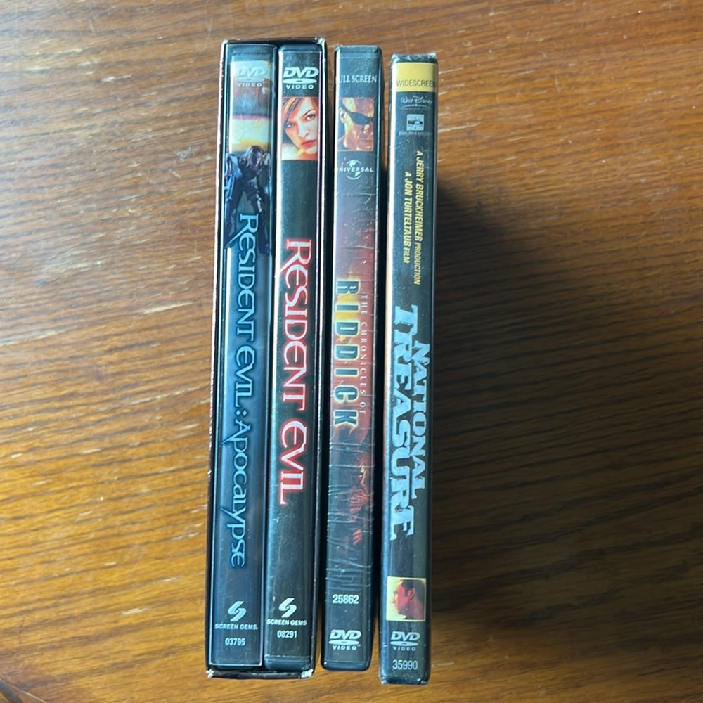 Four DVD’s Resident Evil, Resident Evil Apocalypse, Riddick, National Treasure